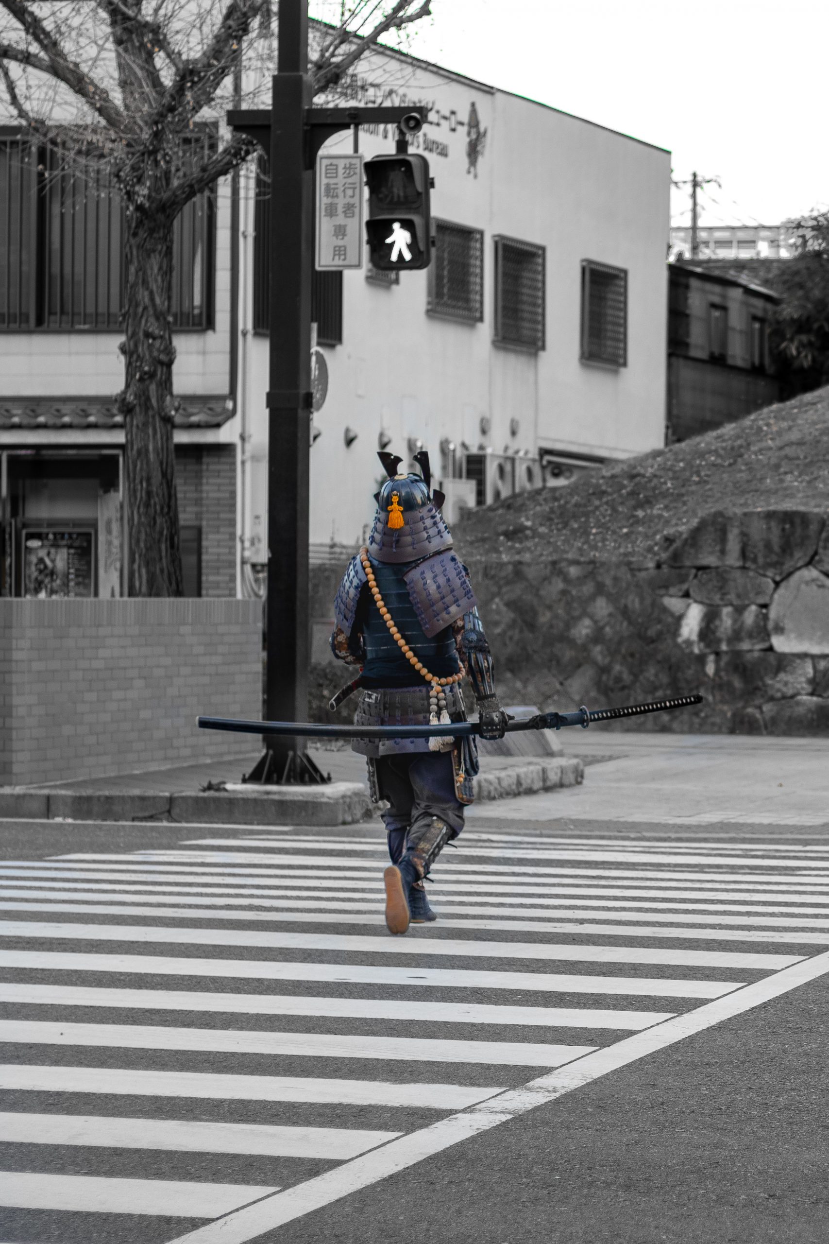 Samurai crossing the street in modern city